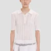 Frill polo top in white